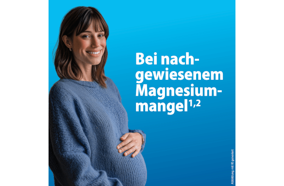 Schwangere Frau streichelt sich den Bauch, Magnesium unterstützt in der Schwangerschaft